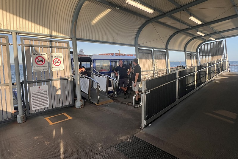 Amity Trader Crew waiting to let on passengers for Coochiemudlo Island